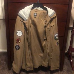 VOLCOM JACKET WITH VARIOUS POP CULTURE PATCHES
